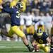 Michigan kicker Brendan Gibbons kicks an extra point in the third quarter at Michigan Stadium. Melanie Maxwell I AnnArbor.com